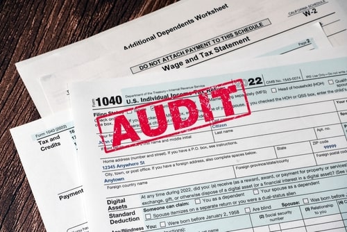 Form 1040 with red IRS audit stamp