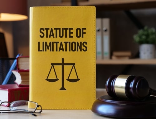 statute of limitations written on book with gavel on desk